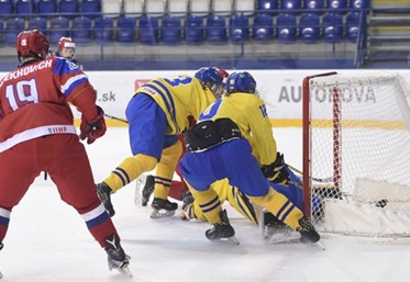POPRAD, SLOVAKIA - APRIL 23: Russia's Kirill Ustimenko #1 looks on as Danila Galeniuk #3 (not shown) scores against Sweden during bronze medal game action at the 2017 IIHF Ice Hockey U18 World Championship. (Photo by Andrea Cardin/HHOF-IIHF Images)